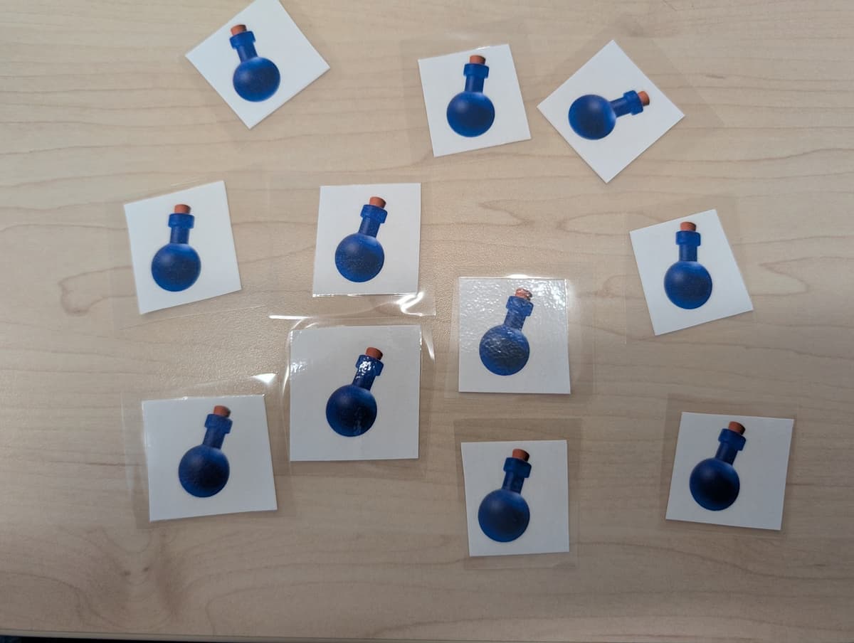 Laminált bájitalkártya fizikai jutalmként használva